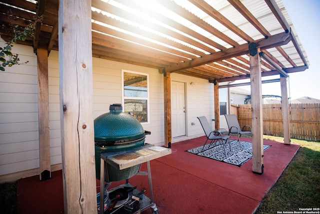 view of patio / terrace with a pergola and fence