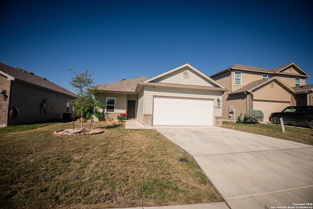 view of front of property with brick siding, driveway, a front yard, and a garage