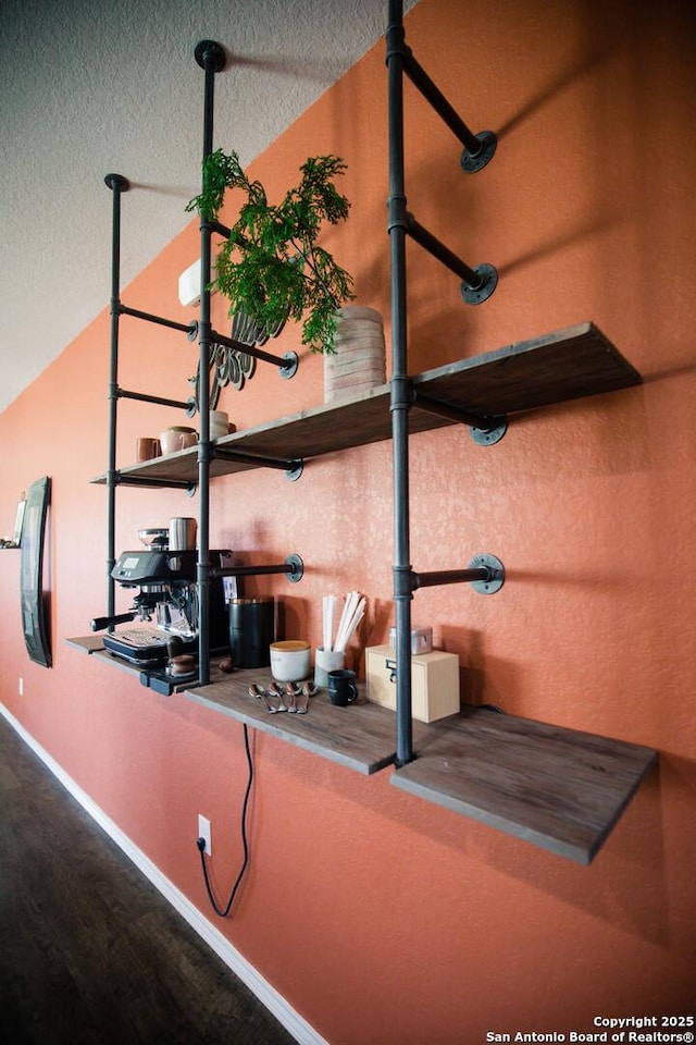details featuring baseboards and a textured ceiling