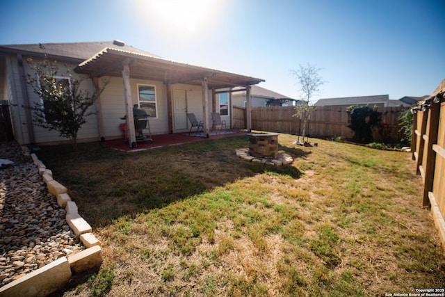 view of yard featuring a patio and a fenced backyard