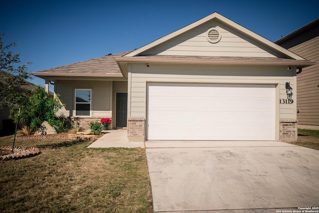 single story home featuring a garage, driveway, brick siding, and a front yard