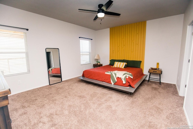 bedroom with carpet floors, ceiling fan, and baseboards