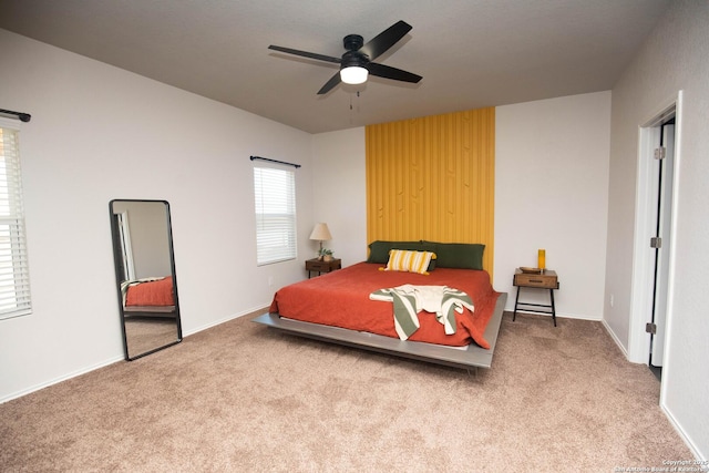 carpeted bedroom featuring a ceiling fan