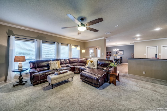 living area with crown molding, carpet flooring, ceiling fan with notable chandelier, and visible vents