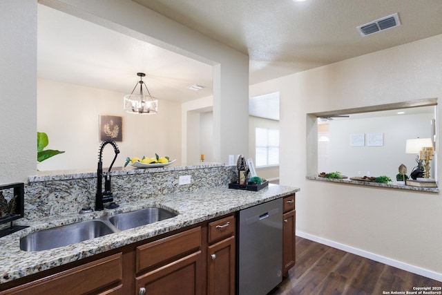 10022 Carswell Peak, San Antonio, TX 78245 - kitchen with visible vents, dark wood finished floors, dishwasher, a sink, and light stone counters