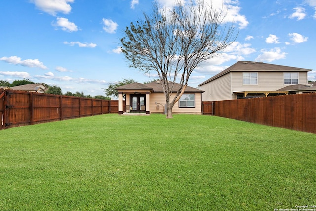 10022 Carswell Peak, San Antonio, TX 78245 - view of yard featuring french doors and a fenced backyard
