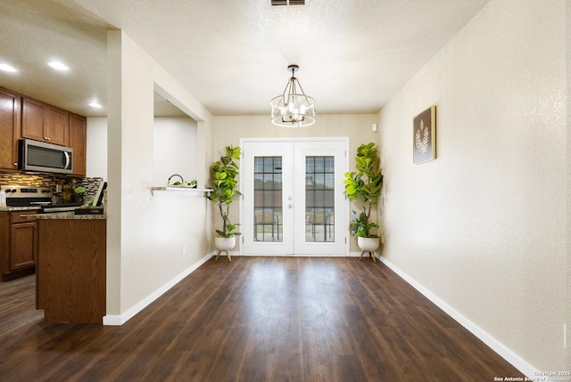 10022 Carswell Peak, San Antonio, TX 78245 - doorway with dark wood-style flooring, baseboards, recessed lighting, a chandelier, and french doors