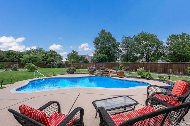 view of pool featuring a fenced in pool, a fenced backyard, a patio area, and a yard