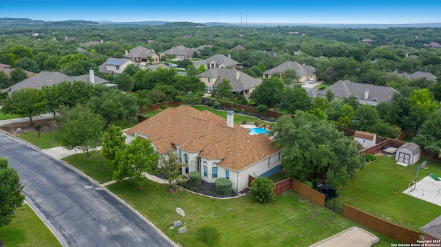 birds eye view of property with a residential view
