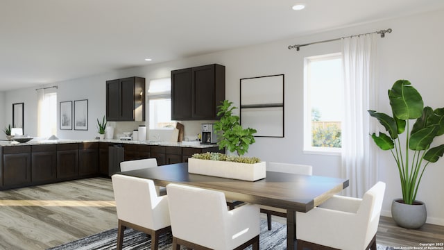 dining room with recessed lighting, light wood finished floors, and a wealth of natural light