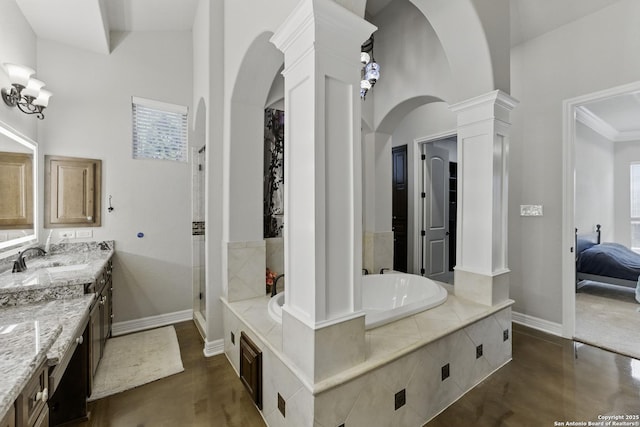 full bathroom with vanity, finished concrete flooring, walk in shower, ornate columns, and a bath