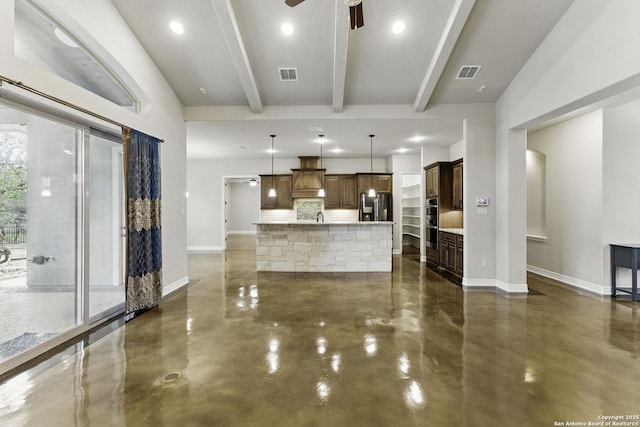 unfurnished living room featuring finished concrete floors, baseboards, beam ceiling, and visible vents