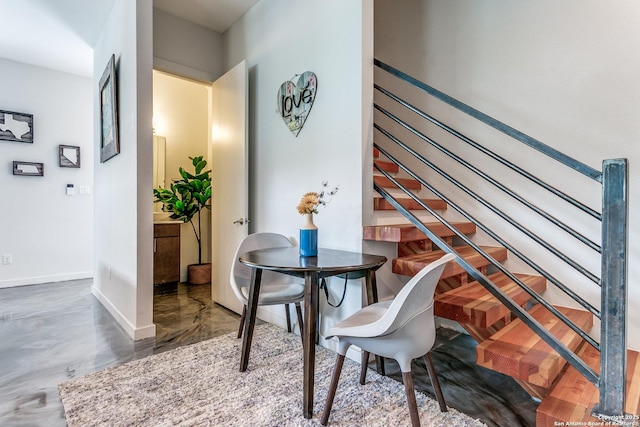 dining space featuring baseboards