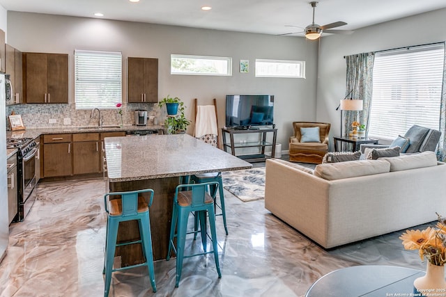 living room with recessed lighting and ceiling fan