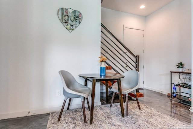 dining space featuring stairway, baseboards, and recessed lighting