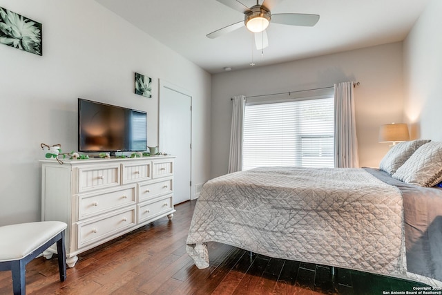 bedroom with dark wood-type flooring and ceiling fan