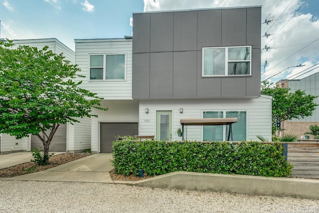 contemporary house featuring a garage and concrete driveway