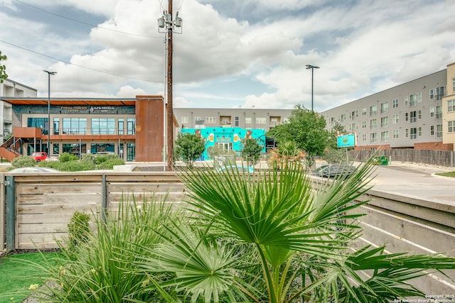 view of community featuring fence