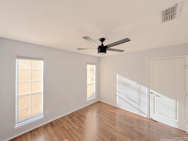 726 Barbara Dr, Canyon Lake, TX 78133 - unfurnished room with visible vents, baseboards, ceiling fan, and wood finished floors