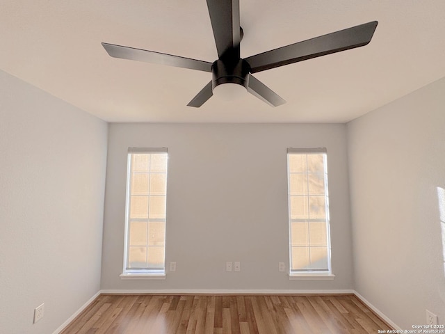 726 Barbara Dr, Canyon Lake, TX 78133 - spare room featuring baseboards, ceiling fan, wood finished floors, and a wealth of natural light