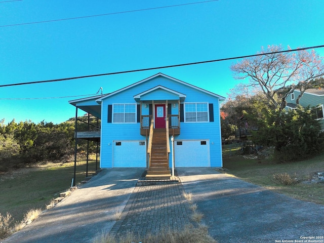 726 Barbara Dr, Canyon Lake, TX 78133 - view of front of home with an attached garage, stairs, and driveway
