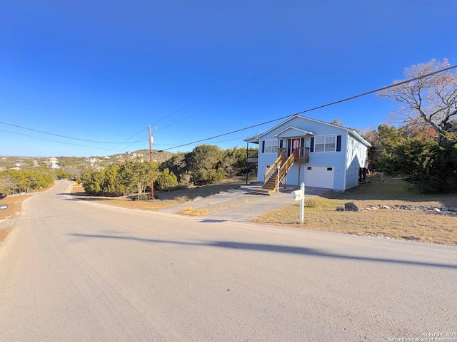 726 Barbara Dr, Canyon Lake, TX 78133 - view of front of property featuring stairs, a garage, and concrete driveway