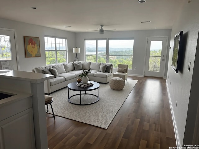 726 Barbara Dr, Canyon Lake, TX 78133 - living room featuring baseboards, ceiling fan, visible vents, and dark wood finished floors