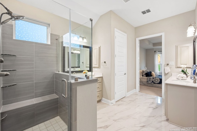 bathroom featuring vanity, visible vents, a healthy amount of sunlight, and a stall shower