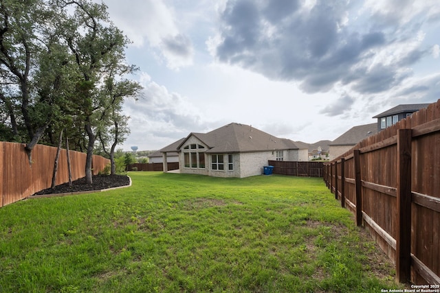 view of yard featuring a fenced backyard
