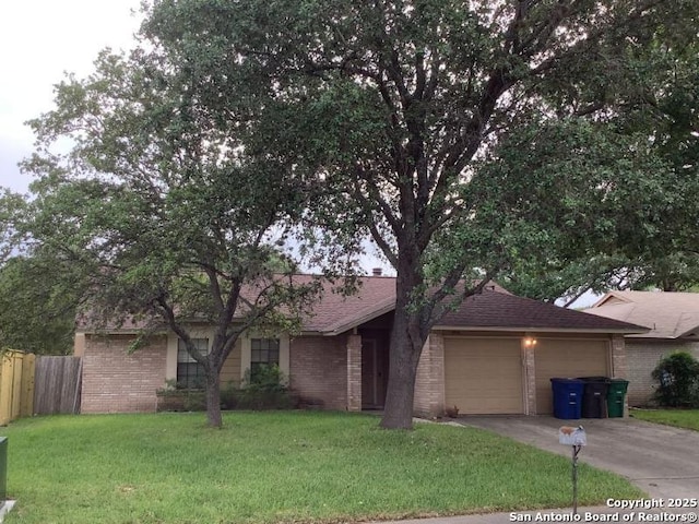 view of front of home with fence, a front yard, brick siding, concrete driveway, and an attached garage