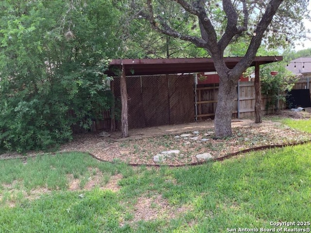 view of outbuilding featuring fence