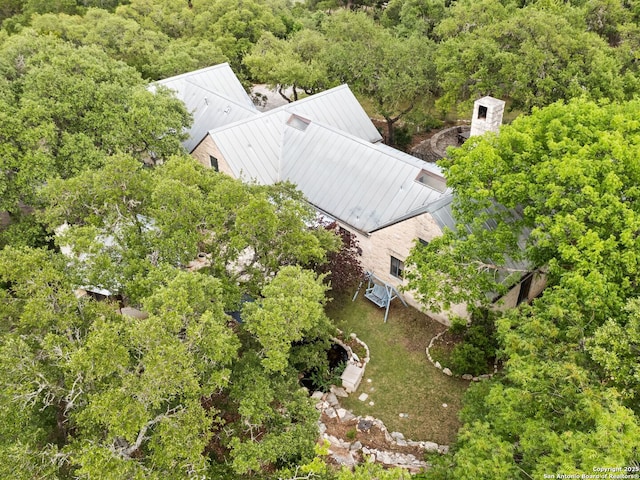 aerial view featuring a wooded view