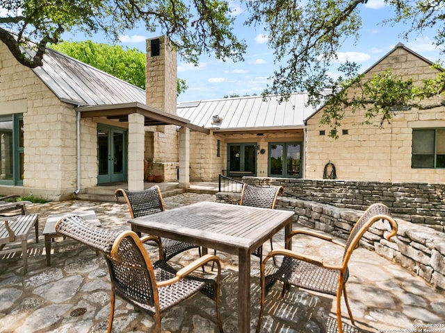view of patio featuring french doors and outdoor dining area