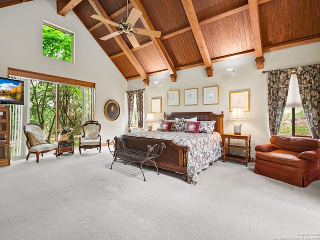 carpeted bedroom with high vaulted ceiling, multiple windows, and beam ceiling