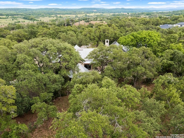 birds eye view of property with a wooded view