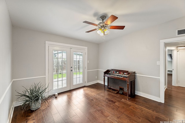doorway featuring dark wood finished floors, french doors, a ceiling fan, baseboards, and visible vents