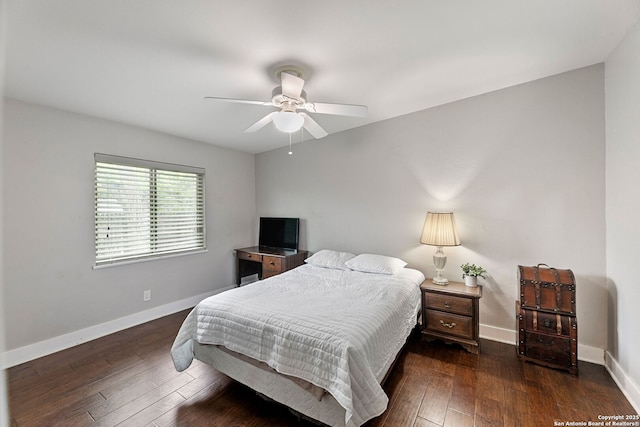 bedroom featuring baseboards, ceiling fan, and hardwood / wood-style floors