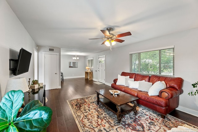 living area with visible vents, baseboards, and dark wood-style floors