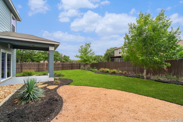 view of yard featuring a fenced backyard and a patio area