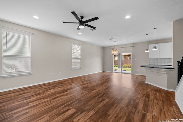 unfurnished living room featuring a ceiling fan, baseboards, recessed lighting, dark wood-type flooring, and visible vents