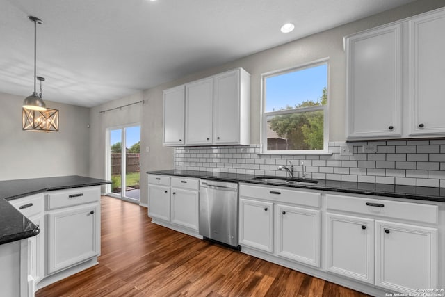kitchen featuring dark wood-style floors, tasteful backsplash, a sink, and dishwasher