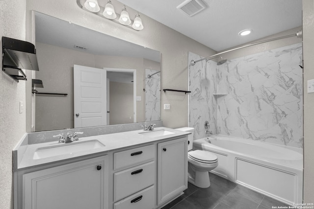 full bathroom with visible vents, a sink, and shower / bathing tub combination