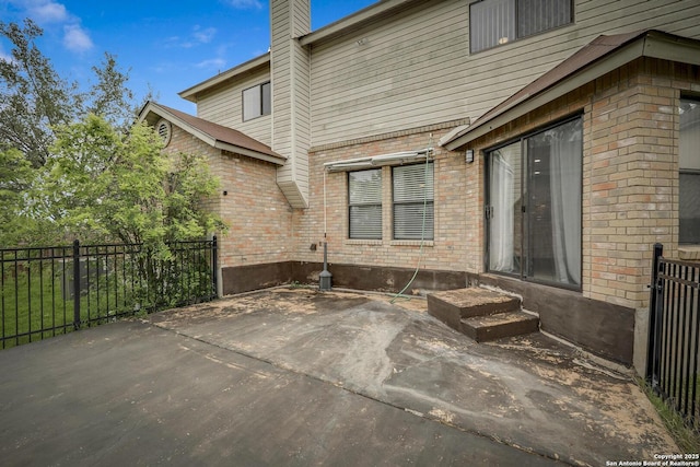 view of patio featuring fence and entry steps