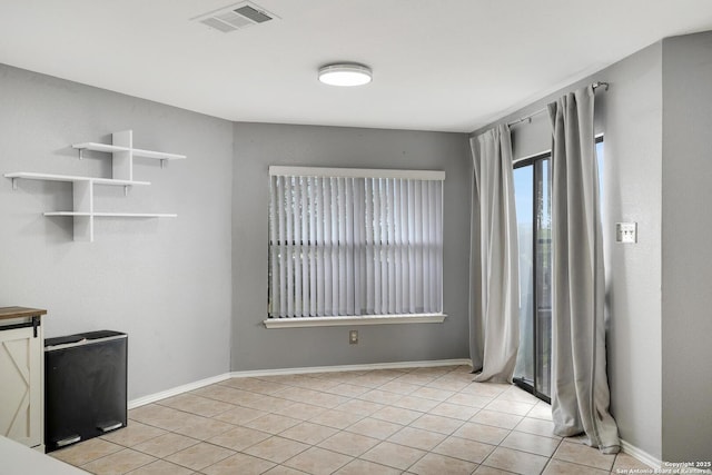 interior space featuring visible vents, baseboards, and light tile patterned flooring