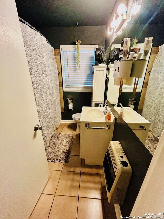 122 Hartford Ave, San Antonio, TX 78223 - full bathroom with toilet, tile patterned floors, and vanity