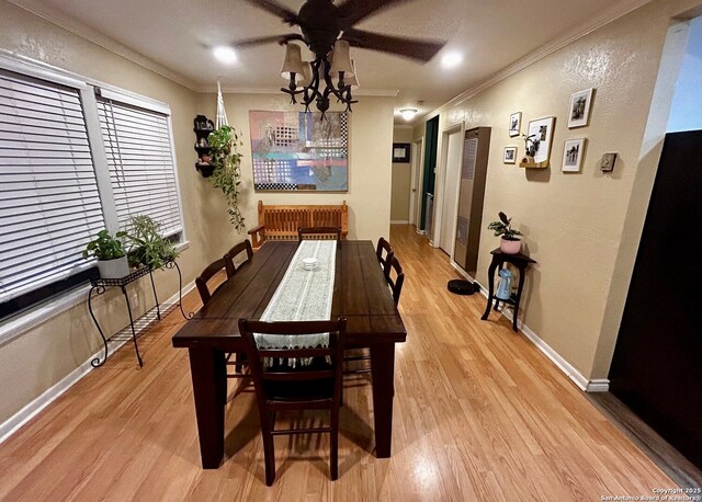 122 Hartford Ave, San Antonio, TX 78223 - dining room with crown molding, ceiling fan, and light wood finished floors