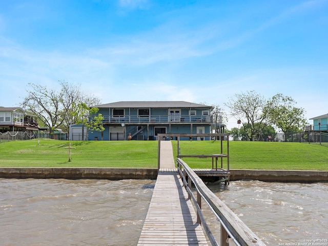 186 Trout, Palacios, TX 77465 - back of property featuring fence, a water view, and a yard