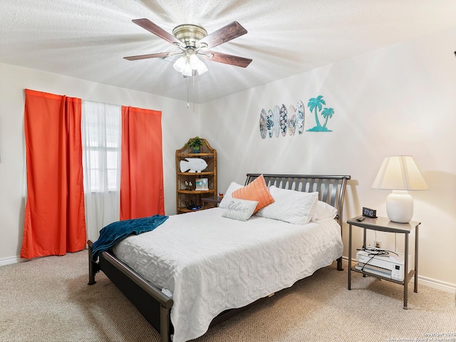 186 Trout, Palacios, TX 77465 - bedroom featuring baseboards, ceiling fan, and carpet flooring