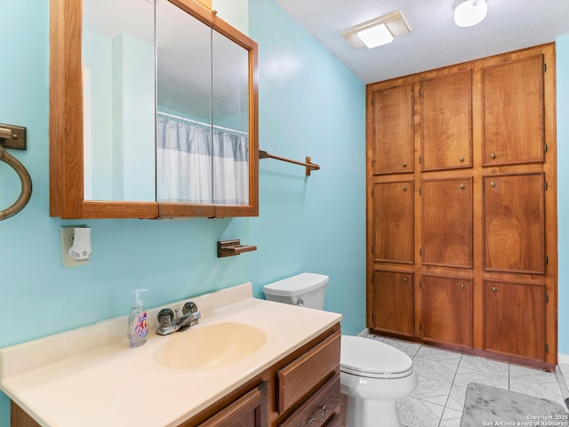 186 Trout, Palacios, TX 77465 - bathroom featuring toilet, a shower with shower curtain, marble finish floor, and vanity