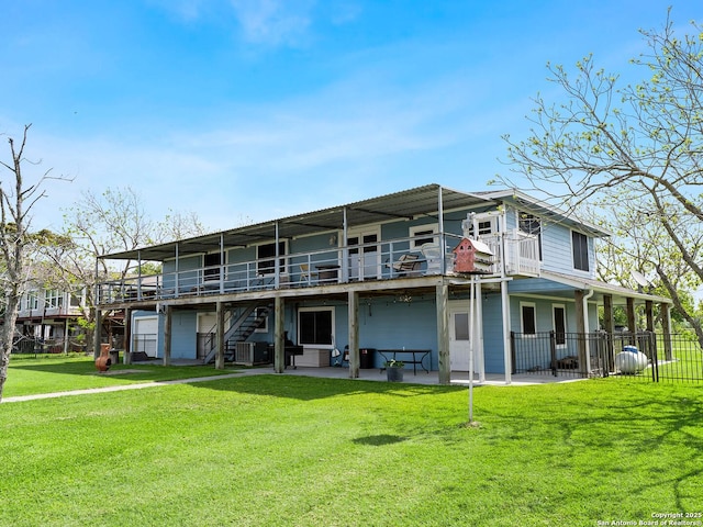 186 Trout, Palacios, TX 77465 - rear view of property with fence, stairs, a wooden deck, a patio area, and a yard